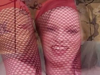 Nasty young brunette in red fishnet stockings eats his tool and receives fucked